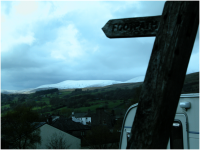 Looking out at the snow-covered Howgills from the footpath on Conder Farm.png