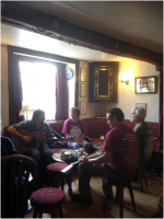 Rehearsing in the Sun Inn, Dent (Roger, the fifth member of the band, must have been 'taking a break'!).png