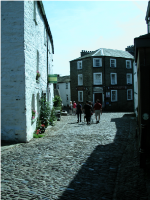 Looking down the cobbles to the George and Dragon pub..png