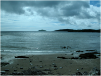 Looking out from Rockcliffe, with Rough Island nearest to the shore and Hestan Island the the distance.png