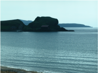 Looking out over Brunerican Bay, with Sanda Island in the background.png