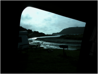 Looking out of the 'van in the twilight, watching the tide come up the little estuary and the weird play of sea versus river water..png